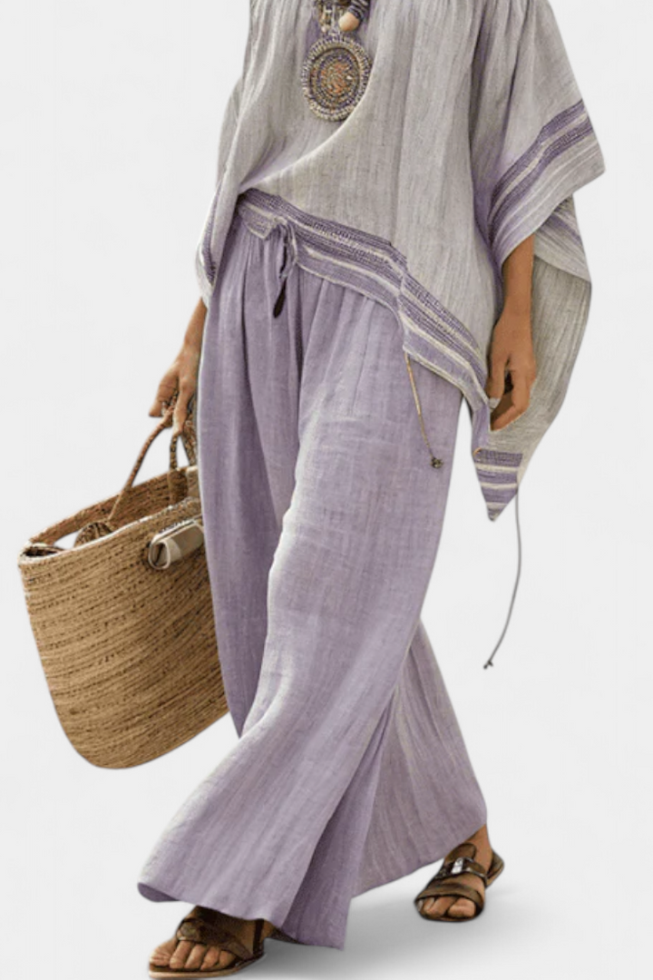 Zoe | Top elegante con hombros descubiertos y pantalones anchos a rayas