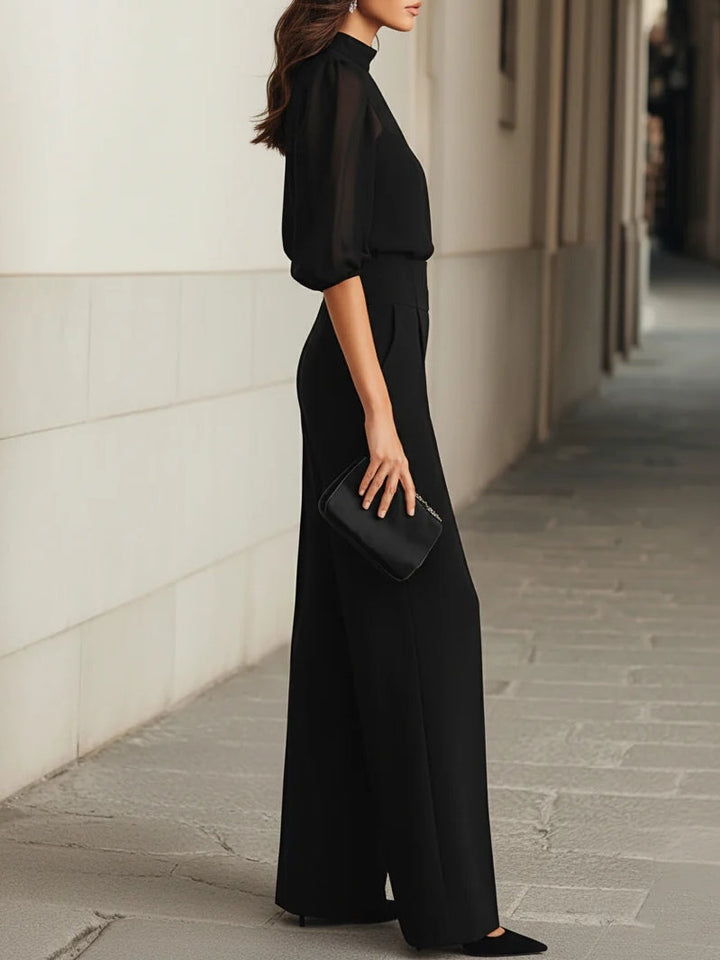 Valentina™ | Conjunto de tres piezas negro, compuesto por una camiseta sin mangas transparente y pantalones de pierna ancha.